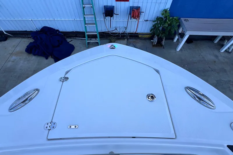 Slide: The Image of Bow of 2022 Blackfin 272 DC boat in a dockside setting. - 88