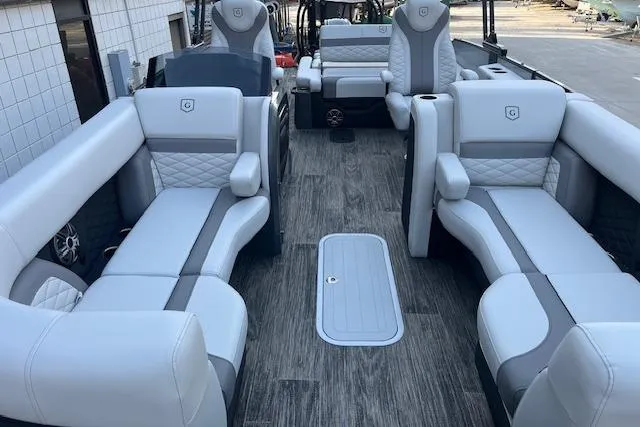 Slide: The Image of Luxurious interior of 2026 Godfrey Monaco 235 SFLC pontoon boat with plush seating. - 11