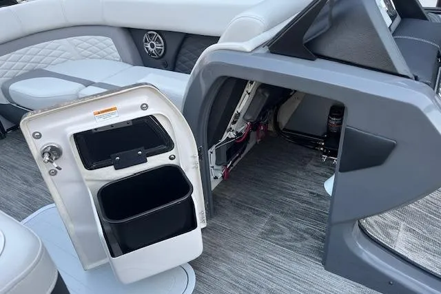 Slide: The Image of Interior of 2026 Godfrey Monaco 235 SFLC boat, featuring storage compartments and seating. - 15