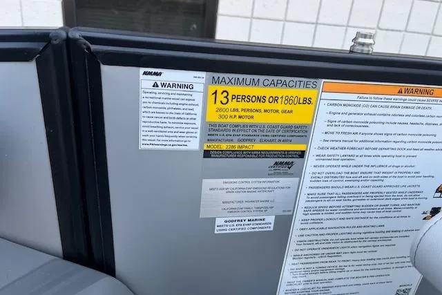 Slide: The Image of 2026 Godfrey Monaco 235 SFLC capacity label, maximum 13 persons or 1860 lbs. - 21