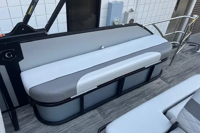 Slide: The Image of 2026 Godfrey Monaco 235 SFLC boat seating, featuring sleek gray and white upholstery. - 23