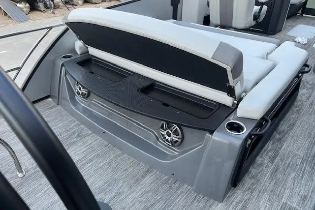 Slide: The Image of 2026 Godfrey Monaco 235 SFLC boat interior with open storage and speakers. - 29