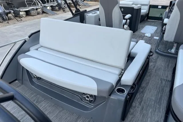 Slide: The Image of 2026 Godfrey Monaco 235 SFLC boat interior with gray and white seating, cup holders, and modern design. - 30
