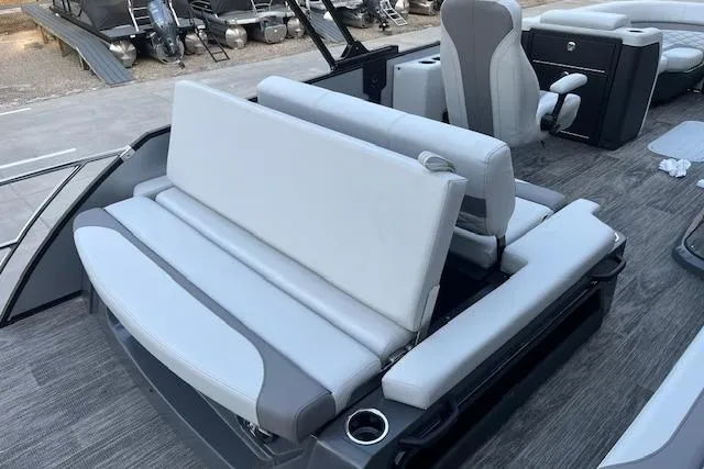Slide: The Image of 2026 Godfrey Monaco 235 SFLC boat interior with gray seating and cup holders. - 31