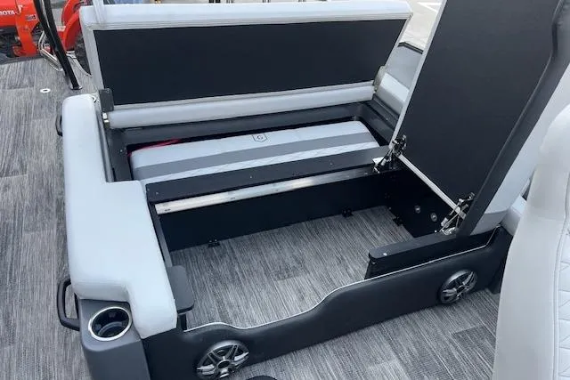 Slide: The Image of 2026 Godfrey Monaco 235 SFLC boat interior with open storage compartment and seating. - 33