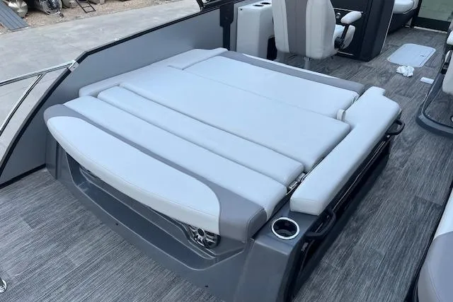 Slide: The Image of 2026 Godfrey Monaco 235 SFLC boat interior with gray seating and cup holders. - 34