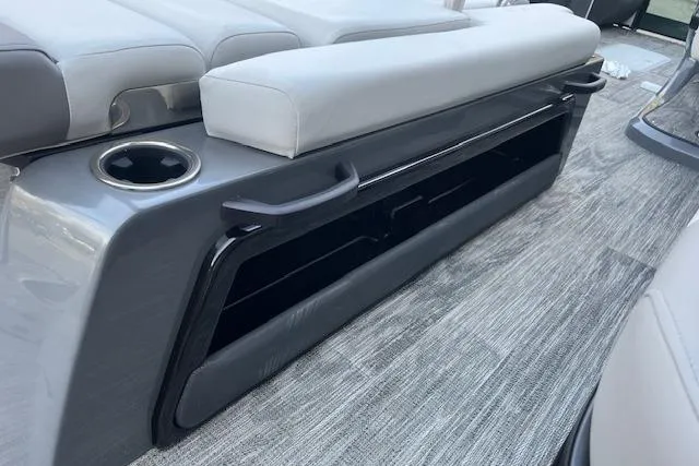 Slide: The Image of 2026 Godfrey Monaco 235 SFLC boat interior with gray seating and cup holder. - 35