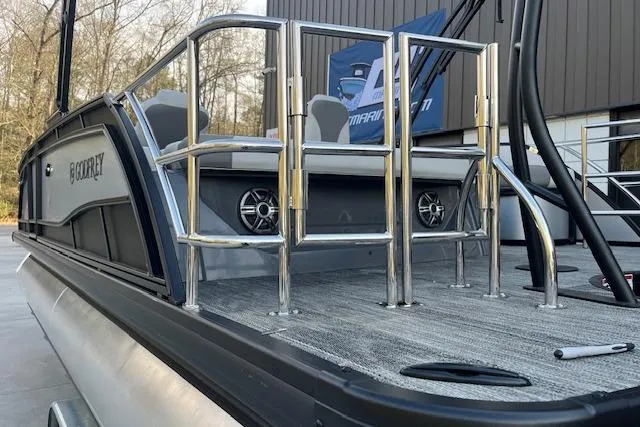 Slide: The Image of 2026 Godfrey Monaco 235 SFLC pontoon boat with sleek design and modern features. - 7