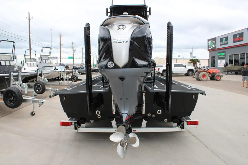Slide: The Image of 2025 Mamba 24 Catamaran Elite on display at a dealership lot. - 15