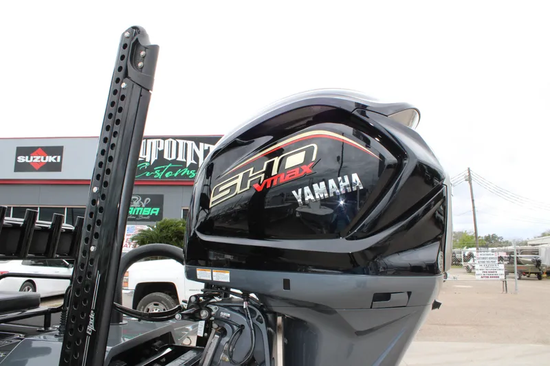 Slide: The Image of 2025 Mamba 24 Catamaran Elite with sleek seating and powerful outboard motor. - 18