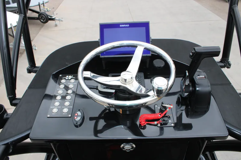 Slide: The Image of 2025 Mamba 24 Catamaran Elite with Yamaha engine at dealership. - 2