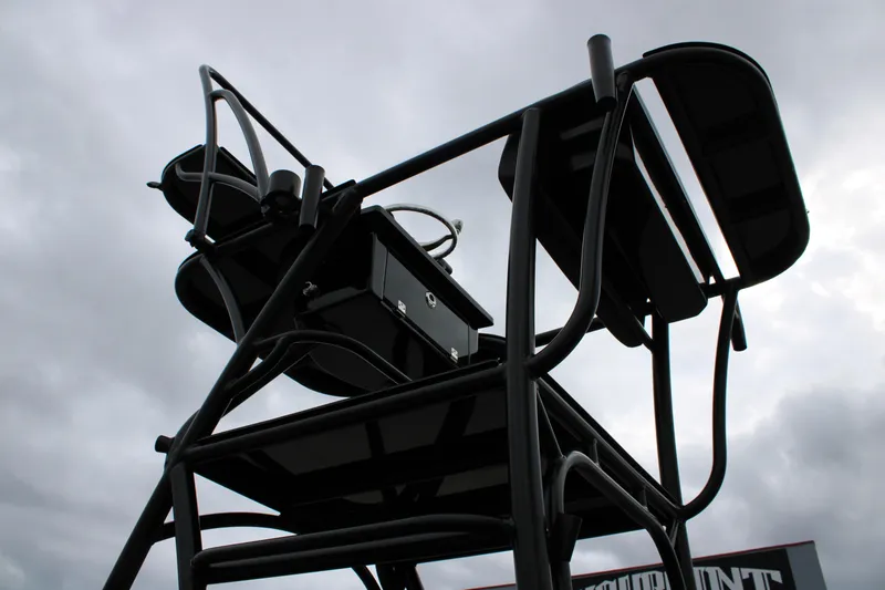 Slide: The Image of 2025 Mamba 24 Catamaran Elite with advanced trolling motor in a parking lot. - 22