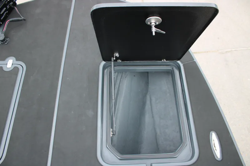 Slide: The Image of 2025 Mamba 24 Catamaran Elite, sleek black deck, modern design, parked outdoors. - 26