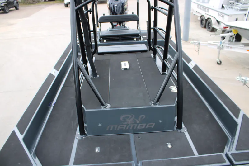 Slide: The Image of 2025 Mamba 24 Catamaran Elite at Waypoint Marine Supercenter, cloudy sky backdrop. - 27