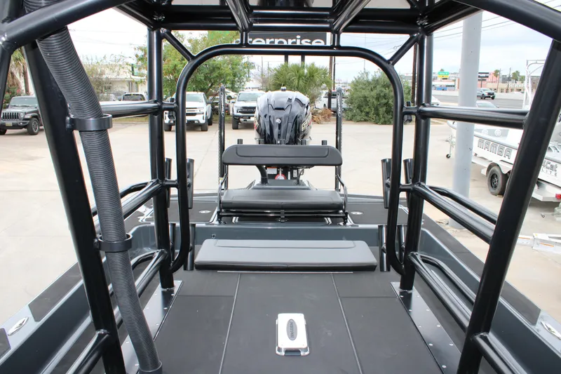 Slide: The Image of 2025 Mamba 24 Catamaran Elite in a dealership lot, showcasing sleek design and structure. - 28