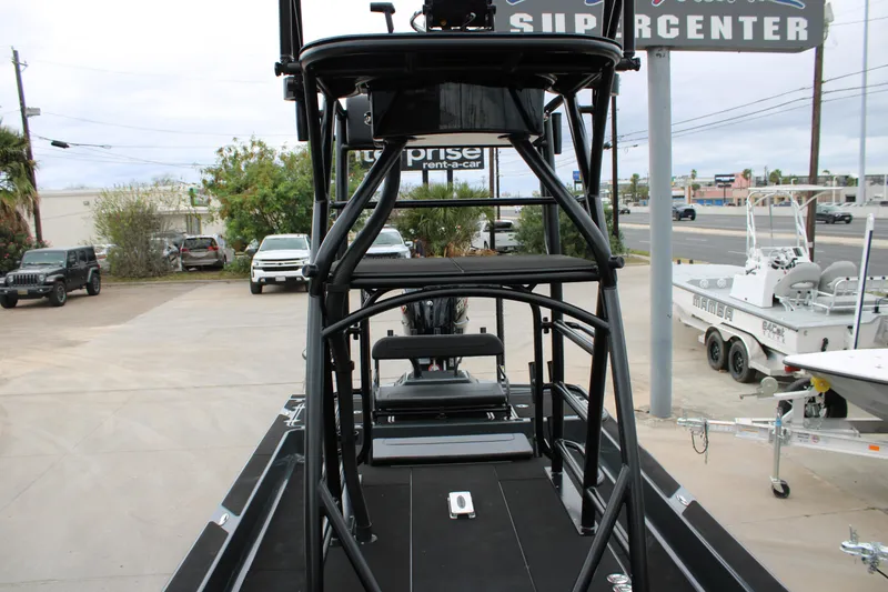 Slide: The Image of Livewell compartment on 2025 Mamba 24 Catamaran Elite boat, featuring sleek black interior design. - 30