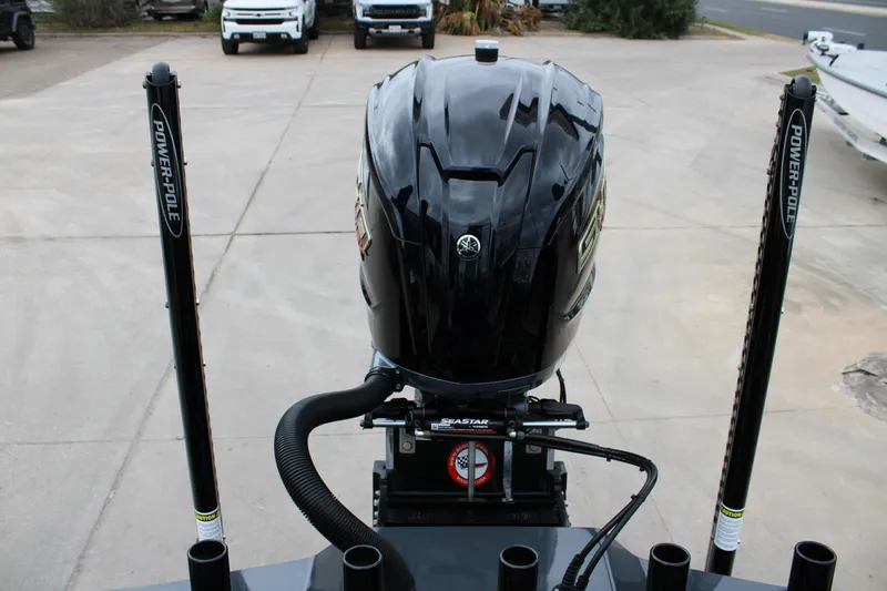 Slide: The Image of 2025 Mamba 24 Catamaran Elite deck with rod holders and sleek black finish. - 35