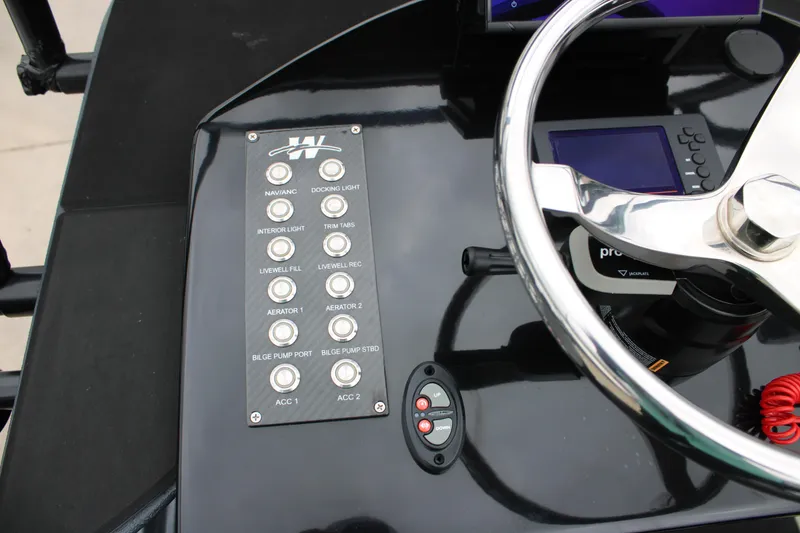 Slide: The Image of 2025 Mamba 24 Catamaran Elite with elevated observation tower, parked outdoors. - 6