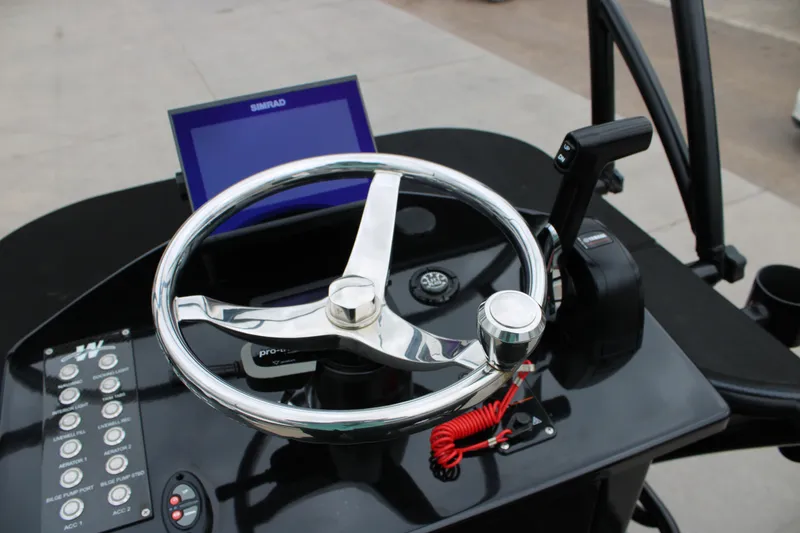 Slide: The Image of 2025 Mamba 24 Catamaran Elite on trailer, rear view, in a dealership lot. - 7