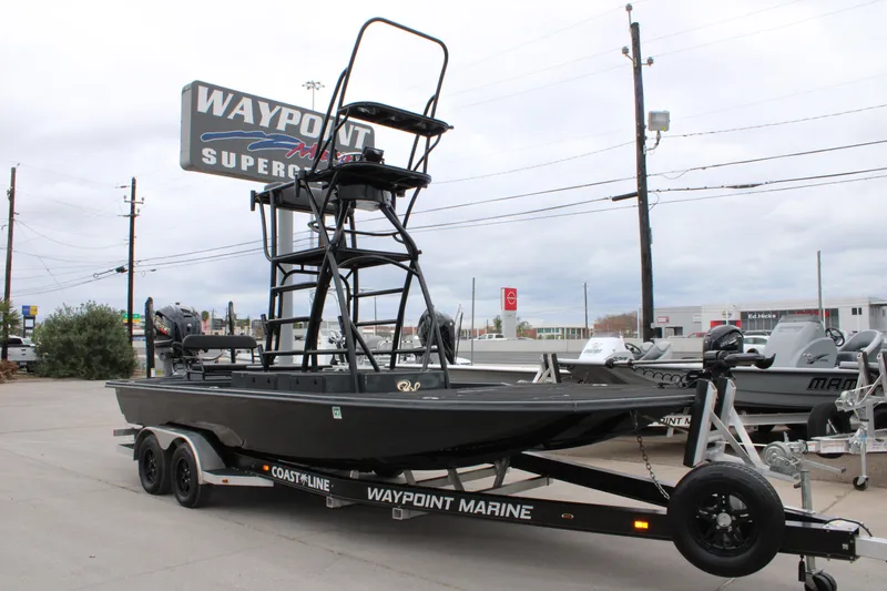Slide: The Image of Steering console of 2025 Mamba 24 Catamaran Elite with modern controls and display. - 8
