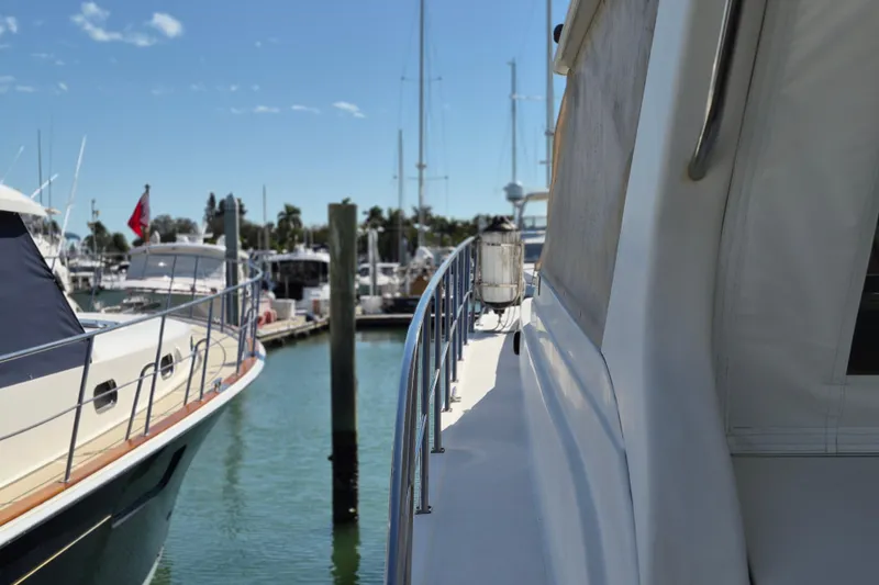 Slide: The Image of 2003 Navigator Californian Veneti yacht docked at marina under clear blue sky. - 11