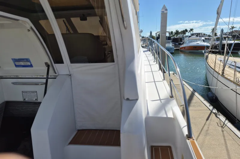 Slide: The Image of 2003 Navigator Californian Veneti yacht docked at marina, sunny day, clear skies. - 12