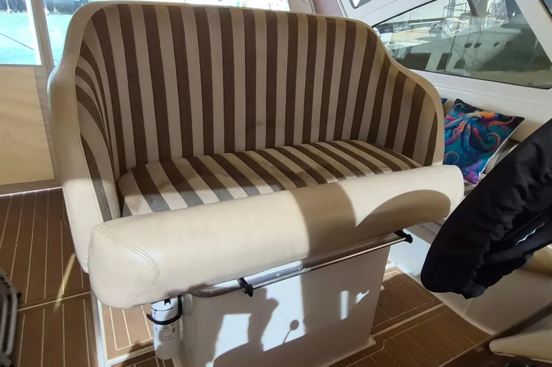 Slide: The Image of Striped seat in 2003 Navigator Californian Veneti boat interior, with colorful cushion. - 16