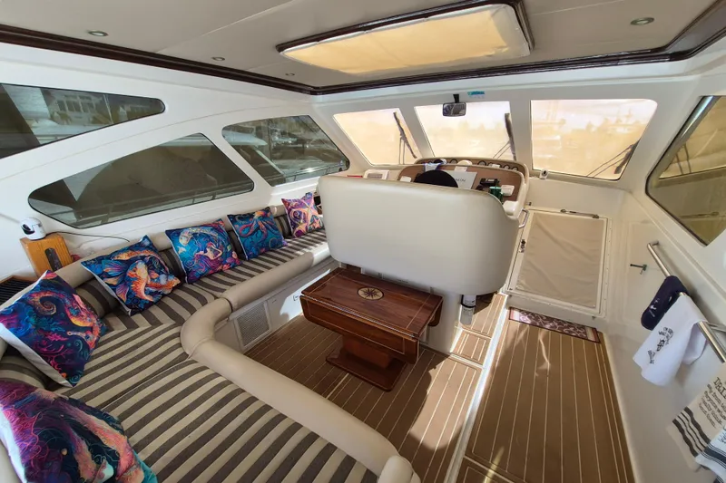 Slide: The Image of Luxurious 2003 Navigator Californian Veneti yacht interior with vibrant cushions and elegant wood accents. - 19