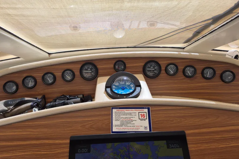 Slide: The Image of Dashboard of 2003 Navigator Californian Veneti boat with gauges and navigation screen. - 20