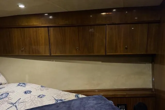 Slide: The Image of Interior of a 2003 Navigator Californian Veneti yacht with wooden cabinetry. - 27