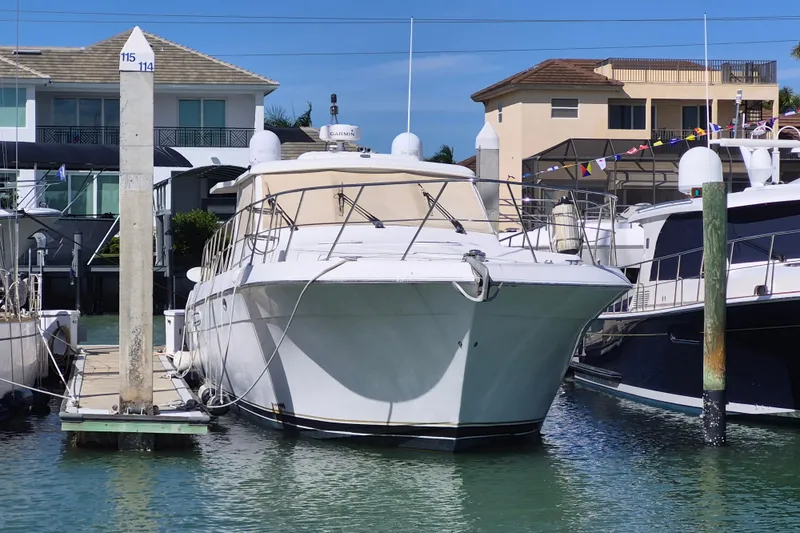 Slide: The Image of 2003 Navigator Californian Veneti yacht docked at marina, surrounded by waterfront homes. - 3