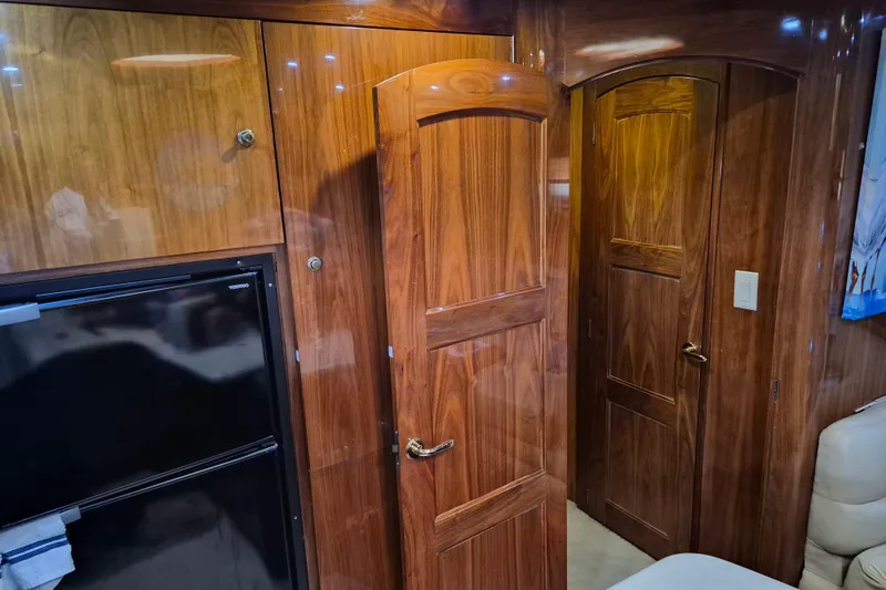 Slide: The Image of Interior of 2003 Navigator Californian Veneti with wooden doors and refrigerator. - 32