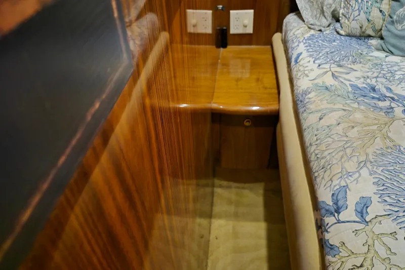 Slide: The Image of 2003 Navigator Californian Veneti interior with wood paneling and floral bedding. - 46