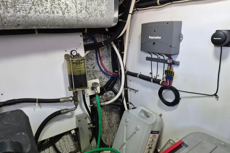 Slide: The Image of Electrical and mechanical components in a 2003 Navigator Californian Veneti boat engine room. - 54