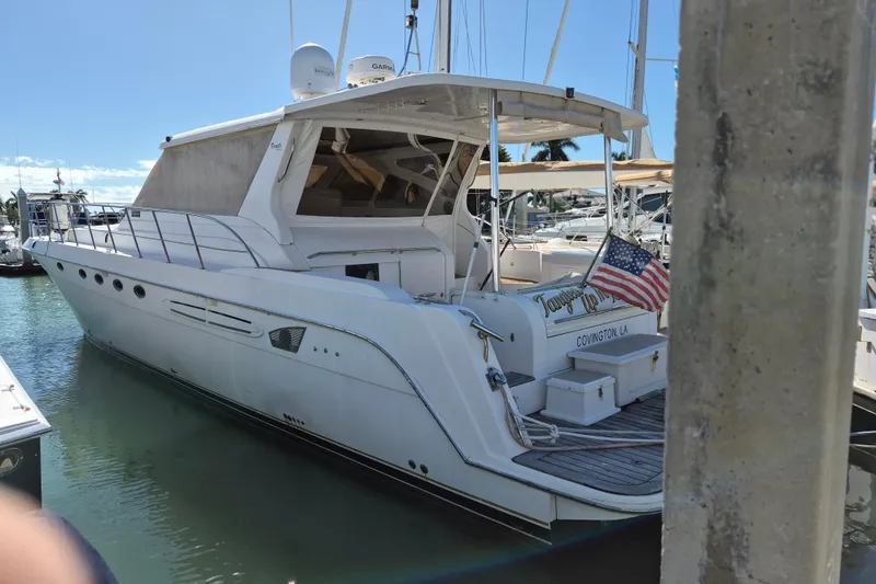 Slide: The Image of 2003 Navigator Californian Veneti yacht docked in marina with American flag. - 7
