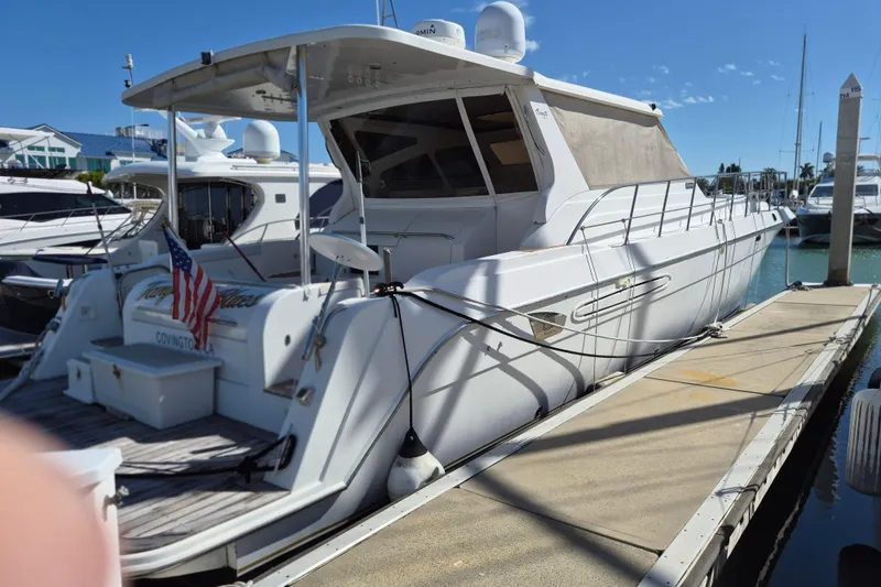 Slide: The Image of 2003 Navigator Californian Veneti yacht docked at marina under clear blue sky. - 8