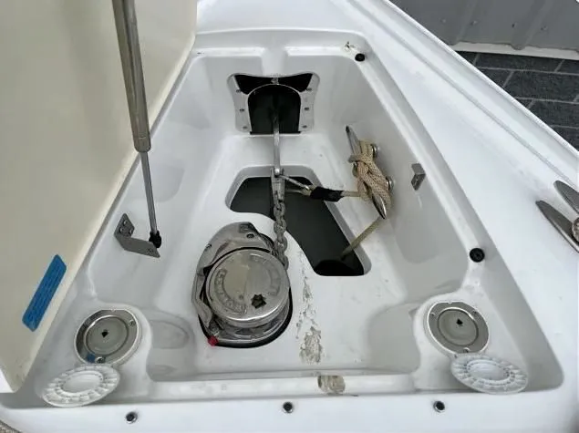 Slide: The Image of Anchor compartment of 2018 Cobalt R35 boat with chain and rope. - 16