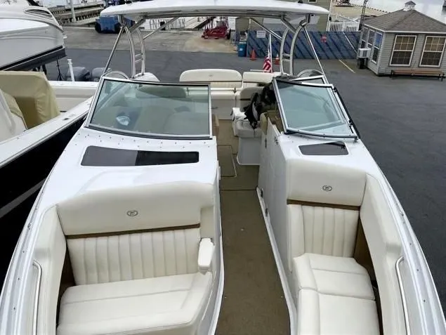 Slide: The Image of Cobalt R35 2018 boat with luxurious white interior at the dock. - 2