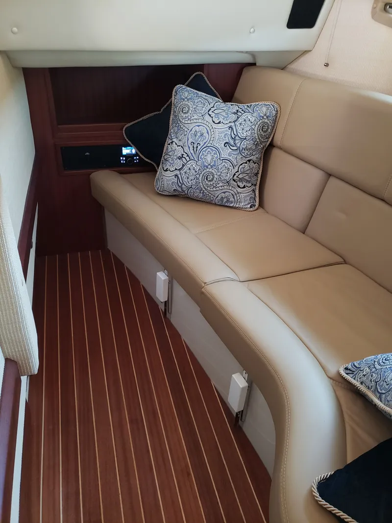 Slide: The Image of Interior of a 2018 Cobalt R35 with leather seating and cushions. - 9