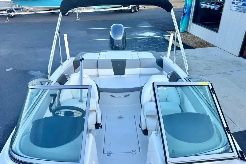 Slide: The Image of 2024 Chaparral 19 SSi OB boat interior with seating and steering wheel. - 17