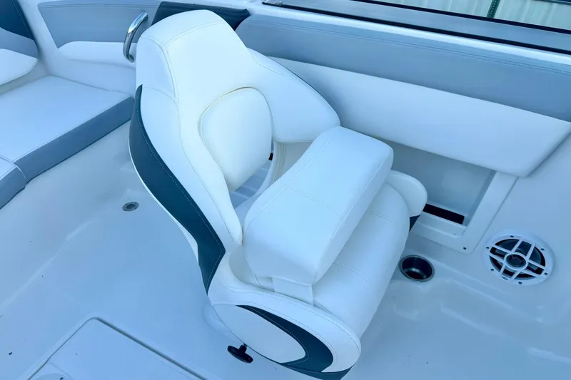 Slide: The Image of 2024 Chaparral 19 SSi OB boat interior with white and gray seating. - 21
