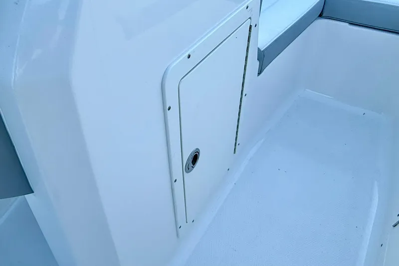 Slide: The Image of 2024 Chaparral 19 SSi OB boat interior with storage compartment. - 23