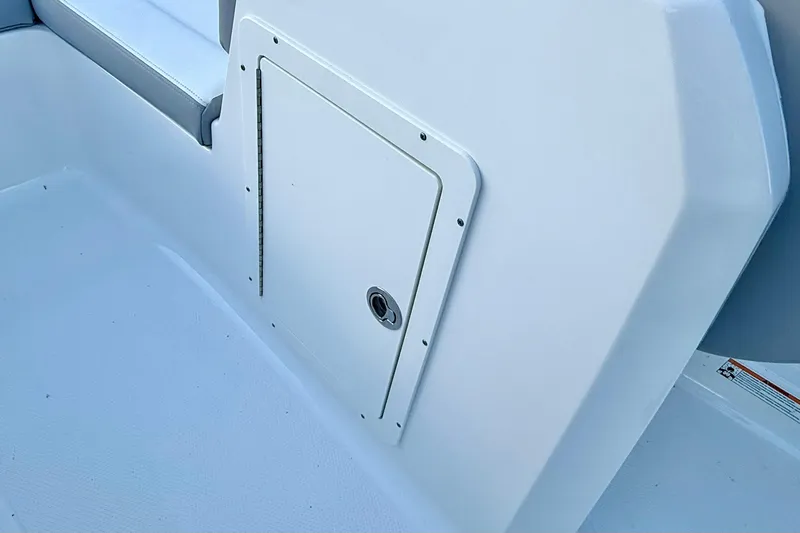 Slide: The Image of 2024 Chaparral 19 SSi OB boat interior storage compartment detail. - 25