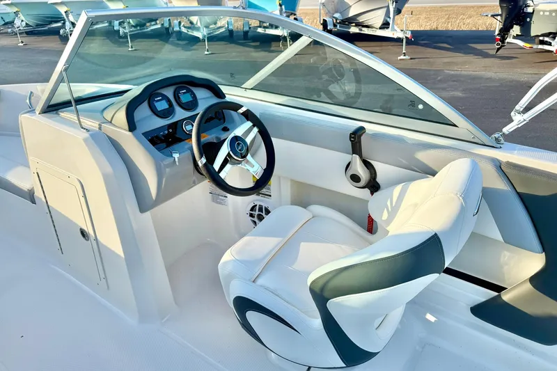 Slide: The Image of 2024 Chaparral 19 SSi OB boat interior with steering wheel and dashboard. - 28