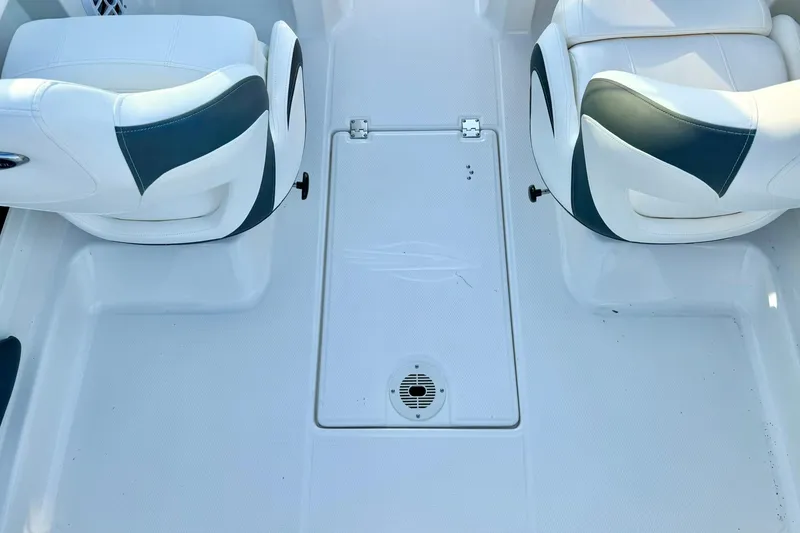 Slide: The Image of 2024 Chaparral 19 SSi OB boat interior with white and teal seating. - 33