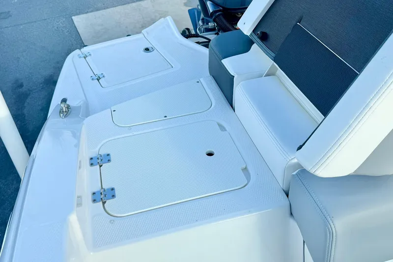 Slide: The Image of 2024 Chaparral 19 SSi OB boat seating and storage compartments. - 38