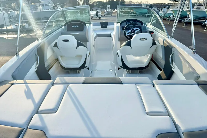 Slide: The Image of 2024 Chaparral 19 SSi OB boat interior with seating and steering wheel. - 58