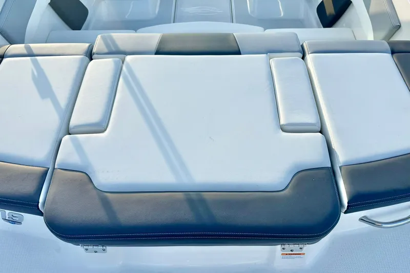 Slide: The Image of 2024 Chaparral 19 SSi OB boat interior with cushioned seating area. - 59