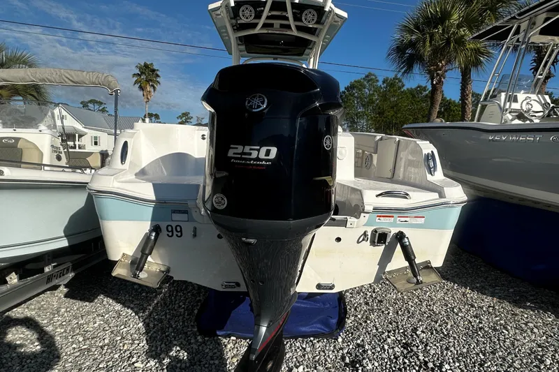 Slide: The Image of 2019 Wellcraft 222 Fisherman boat with Yamaha 250 outboard motor, parked on gravel. - 3