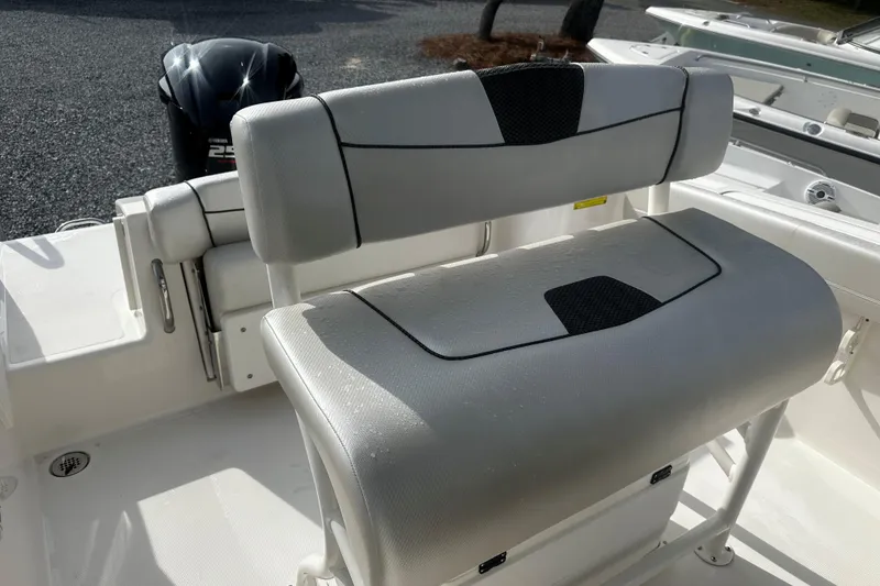 Slide: The Image of 2019 Wellcraft 222 Fisherman boat interior with cushioned seating and Yamaha outboard motor. - 6